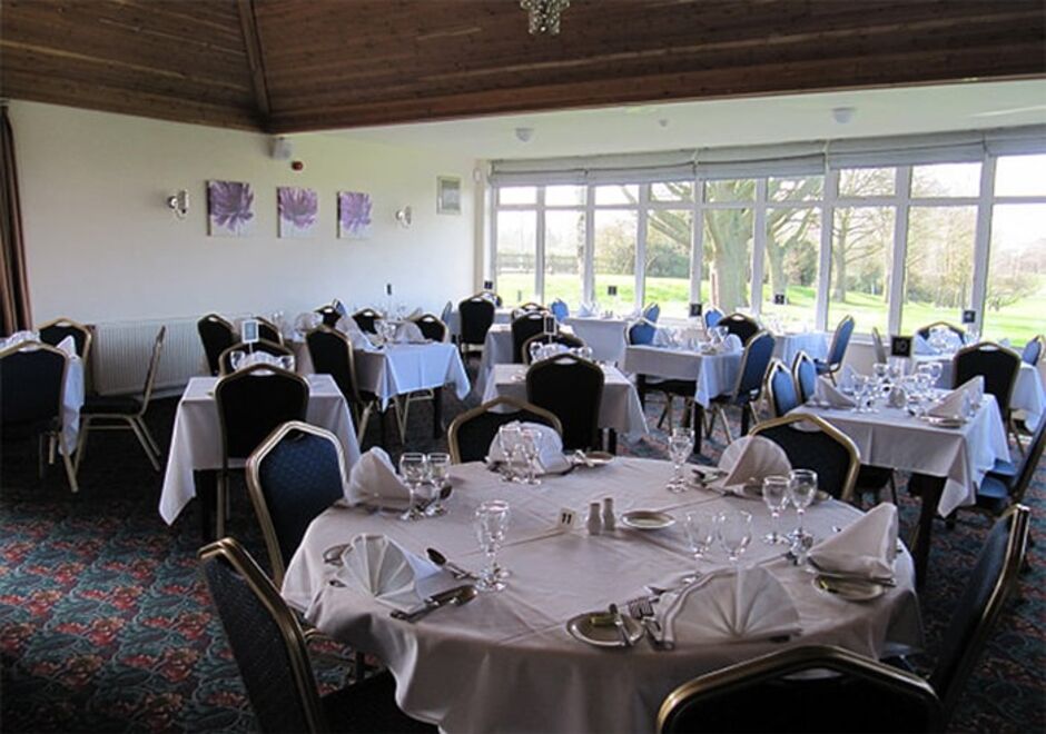 Lutterworth Golf Club Function Room, set out for a celebration meal, overlooking the course Lutterworth Golf Club Function Room, set out for a celebration meal, overlooking the course